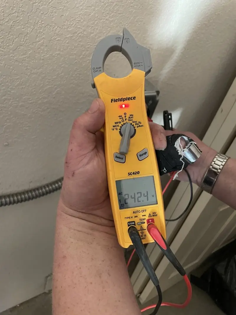 Voltage testing with clamp meter during Generator Installation in Scituate